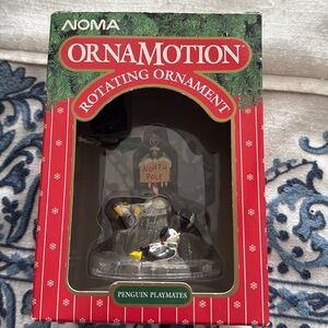 NOMA Ornamotion Penguin with North Pole Sign